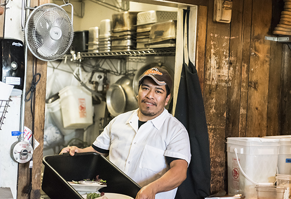 kitchen employee with basin