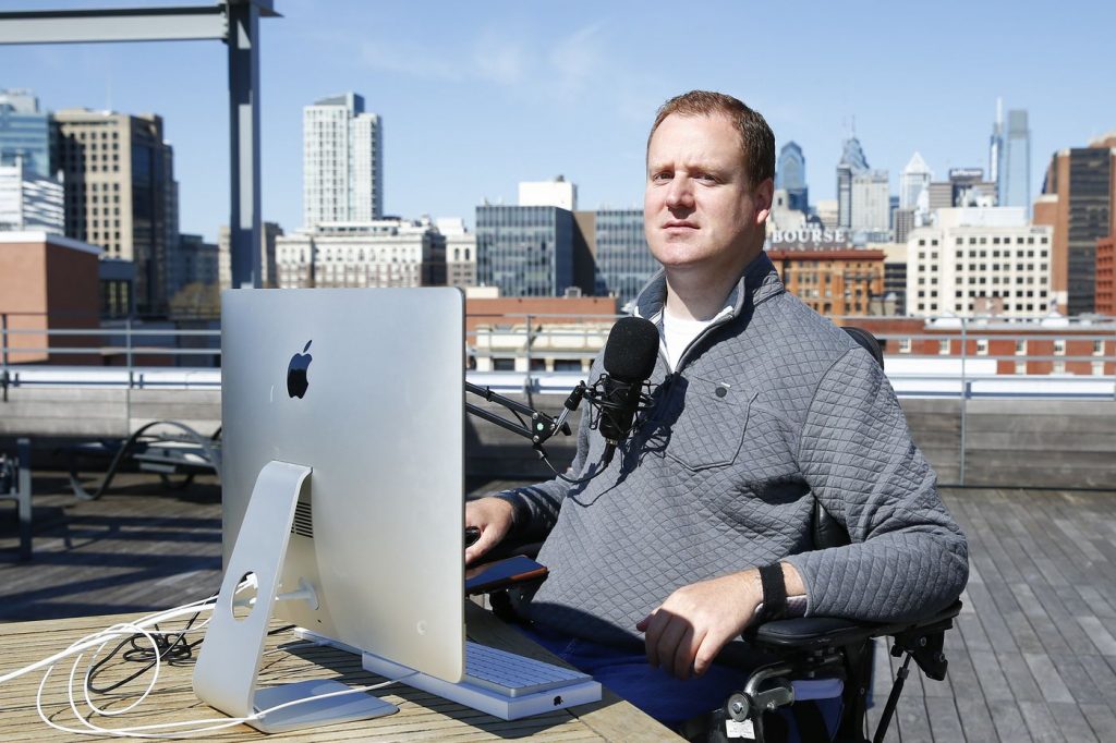 Chef Eli Kulp on roof with microphone and laptop