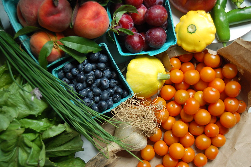 organic produce food like beries tomatoes chives plums squash