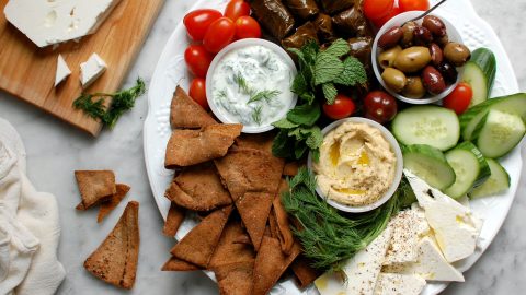 mezze platter with hummus tzatziki pita olives and feta