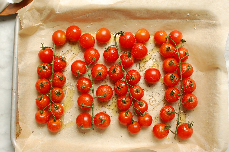 on the vine grape tomatoes on baking sheet