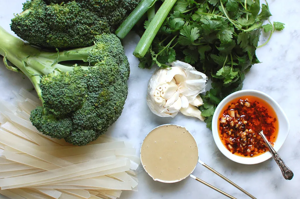 ingredients for Chinese noodle salad broccoli tahini garlic rice noodles