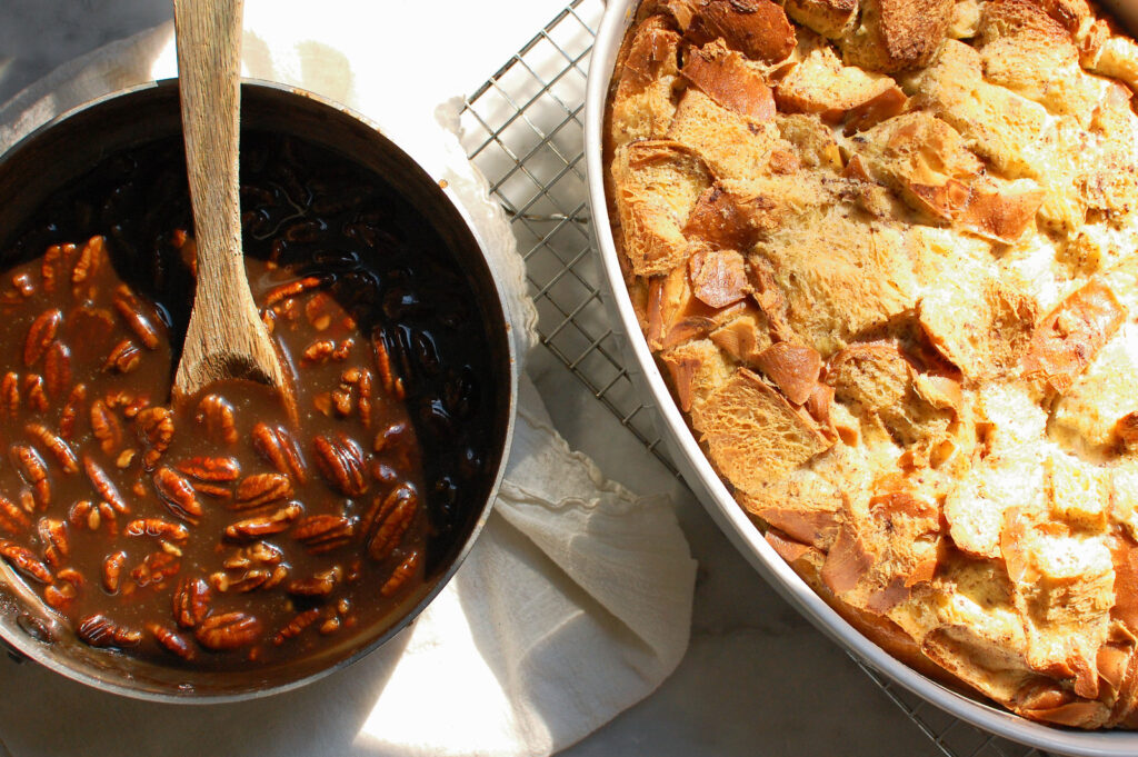 baked overnight French toast casserole in baking dish on cooling rack before pecan caramel topping added and served