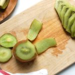 peel kiwi with paring knife and then slice into rounds