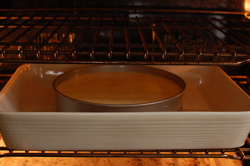 cheesecake in water bath in oven