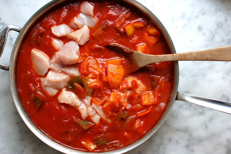 chicken added to tomato and pepper cacciatore