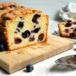 blueberry pound cake recipe, sliced, showing a moist crumb studded with juicy blueberries