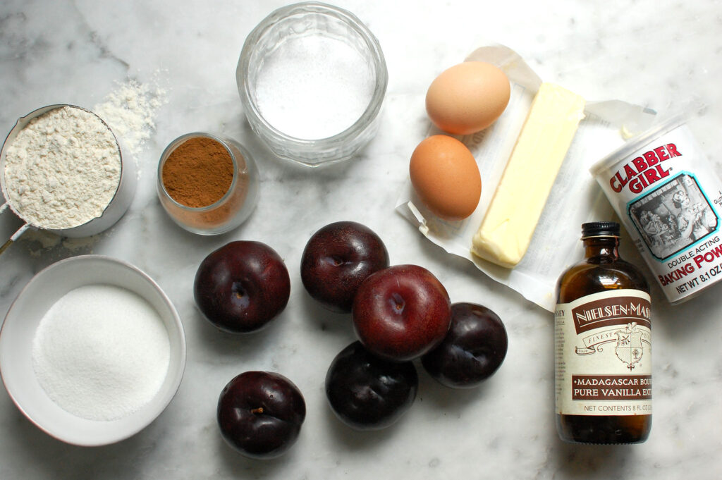 ingredients for NYT plum cake plum torte recipe, including butter, eggs, flour, sugar, plums, cinnamon