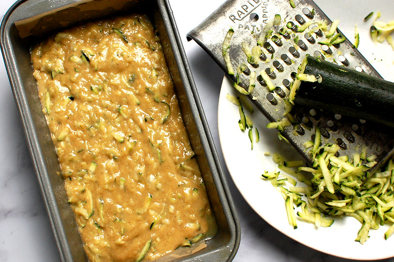 zucchini cake batter in loaf pan before baking