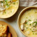 authentic New England fish chowder recipe with haddock, potatoes, and chives in bowls