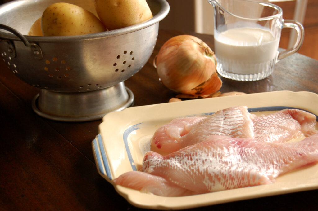 Ingredients for haddock chowder: haddock, potatoes, onion, butter, evaporated milk, and cream