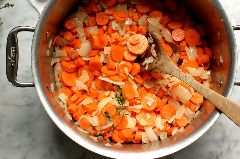 chopped onions and carrots in pot