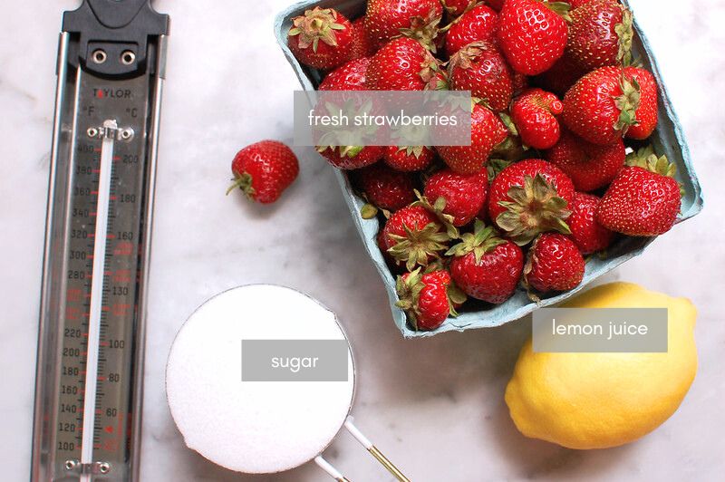 ingredients for strawberry preserves with thermometer