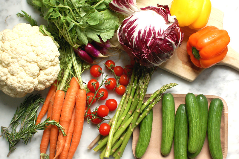 arrangement of the best vegetables for crudite platter: carrots, asparagus, cucumber, tomatoes, cauliflower, celery, bell peppers