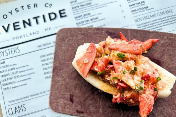 lobster roll on plate for the best restaurants in Portland Maine foodie guide